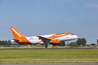 EasyJet Airbus A319-111 with registration OE-LQM lands on the Polderbaan, Amsterdam Schiphol