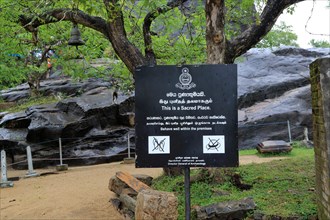 Notice at Gal Viharaya, UNESCO World Heritage Site, the ancient city of Polonnaruwa, Sri Lanka,