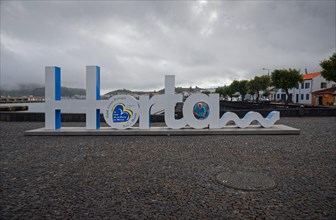 Lettering 'Horta' as a 3D sculpture in the public square of the harbour of Horta, Horta, Faial