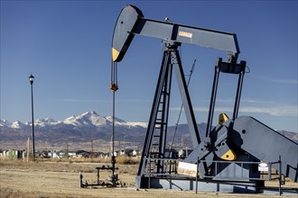 Frederick, Colorado, An oil well near a housing subdivision on Colorado's front range, with Mount