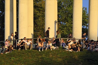 People enjoying the autumn sun at the Monopteros in the English Garden, Munich, Bavaria, Germany,