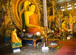 Large Buddha statue at Gangaramaya Temple, Colombo, Sri Lanka, Asia