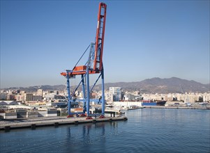 Cranes standing on quayside in the port of Malaga, Spain, Europe