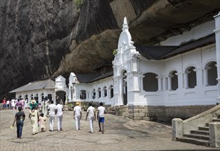 People at Dambulla cave Buddhist temple complex, Sri Lanka, Asia