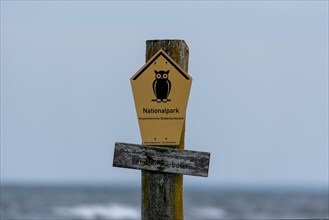 National park sign with owl logo, Vorpommersche Boddenlandschaft National Park, Baltic Sea, Zingst,