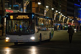 Public transport bus at night under urban street lighting, Leopoldplatz, Pforzheim, Germany, Europe
