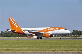 EasyJet Airbus A319-111 with registration G-EZDI lands on the Polderbaan, Amsterdam Schiphol