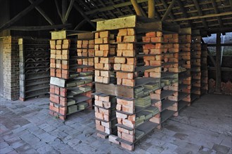 Drying yard with bricks and tiles in shelves at brickworks, Boom, Belgium, Europe