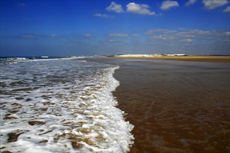 Wave breaking on sandy beach at Conil de la Frontera, Cadiz Province, Spain, Europe