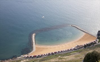 Sandy bay beach created by rock groynes, Gibraltar, British terroritory in southern Europe, Europe