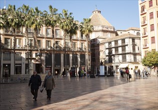 People walking across Plaza Constitucion, Malaga, Spain, Europe