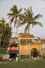 Small restaurant and palm trees in historic town of Galle, Sri Lanka, Asia