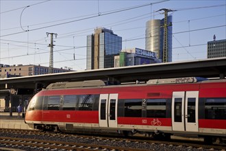 Local train at the main station in front of skyscrapers, Dortmund, Ruhr area, Germany, Europe