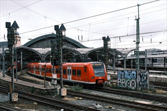 Red train at the main station, Cologne, North Rhine-Westphalia, Germany, Europe