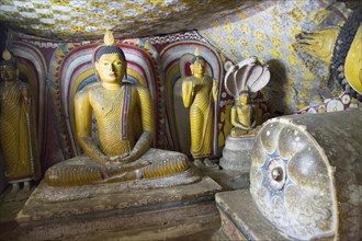 Buddha figures inside Dambulla cave Buddhist temple complex, Sri Lanka, Asia