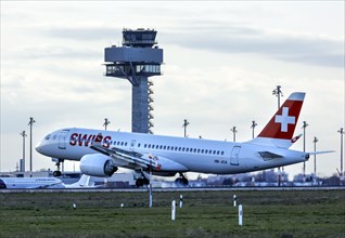 An Airbus A-220-371 of the airline Swiss lands at BER Berlin Brandenburg Airport Willy Brandt,