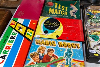Vintage boxed children's board games and toys on display at auction room, UK