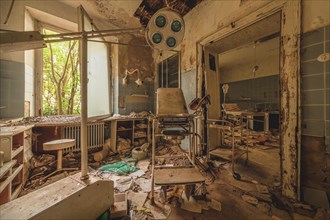 Abandoned hospital room with debris and outdated medical equipment, urologist's villa Dr Anna L.,