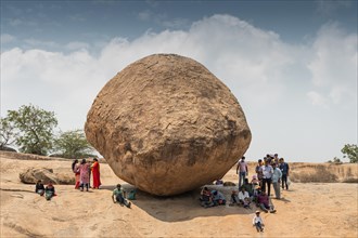 Indian tourists, Krishna's butterball, natural boulder, UNESCO World Heritage Site, Mahabalipuram