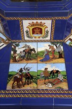 Ceramic tiles on street furniture seat scenes from Cervantes Don Quixote story, Algeciras, Spain,