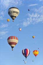 Balloonists, Aeronauts flying in hot-air balloons during ballooning meeting