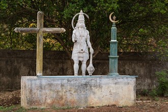 Symbols for three religions, Christian cross, Hindu monkey god Hanuman, Islamic crescent, Andhra