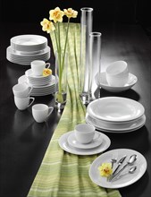 Plates, cups, cutlery, flower vases, table decorations