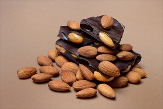 Chocolate with almonds and a bunch of almonds, Prunus dulcis