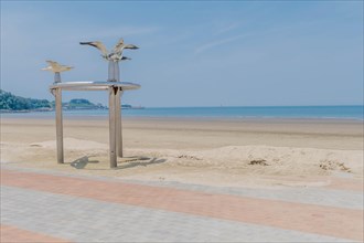Metal artwork of seagull flying at Chunjangdae beach in South Korea