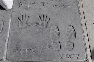 Handprints and footprints of MATT DAMON, Hollywood Boulevard, Los Angeles, California, USA, North