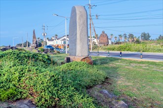 Large stone monuments at public park under blue sky in Jeju, South Korea, Asia