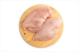 Raw chicken breast on a wooden cutting board isolated on white background. Top view, flat lay,