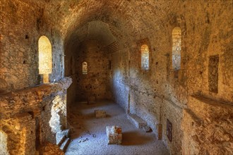 Interior view of a historic fortress with stone vaults and walls, Chlemoutsi, High Medieval