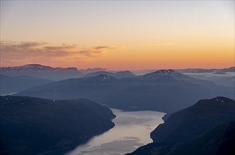View of Faleidfjorden fjord, mountain peaks in soft light at sunset, view from the top of Skala,