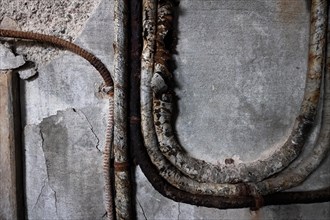 Old corroded pipes, abandoned herring factory Djupavik, Reykjarfjoerour, Strandir, Arnes,