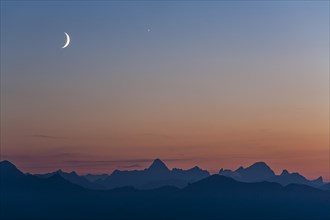 Mountain range at dusk with crescent moon, summer, Allgaeu Alps, Allgaeu, Germany, Europe