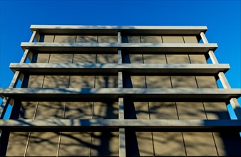 Modern Design of a Building with Tree Shadow and Blue Clear Sky in a Sunny Day in Switzerland