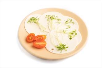 White cheese with tomatoes and cilantro microgreen isolated on white background. side view, close