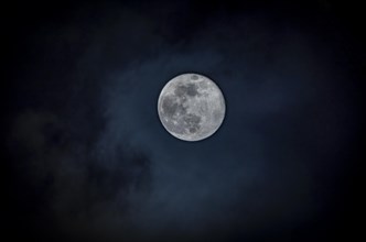 Moon, full moon with clouds in the sky, Germany, Europe