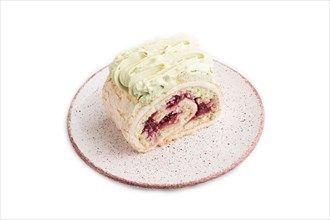 Roll biscuit cake with cream cheese and jam isolated on white background, side view, close up