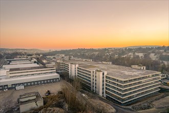 Aerial view of old Bader industrial buildings at sunset with warm colours, Pforzheim, Germany,