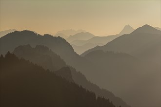 Mountain peak silhouette in the morning light, haze, backlight, Ammergau Alps, Upper Bavaria,