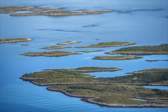 Rocky islands in the blue sea, sea with archipelago islands, Ulvagsundet, Vesteralen, Norway,