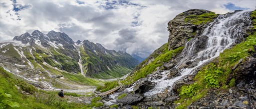Panorama, green mountain valley Floitengrund with mountain stream Floitenbach, mountaineer on a