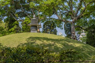Round stone carved pagoda on hilltop in Hiroshima Peace Park in Hiroshima, Japan, Asia
