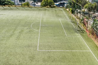 Soccer goal at end of green field in urban park in Istanbul, Tuerkiye