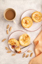 Traditional portuguese cakes pasteis de nata, custard small pies with almonds with cup of coffee on