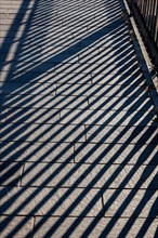 Shadow of a Railing on the Street in Campione d'Italia, Lombardy, Italy, Europe