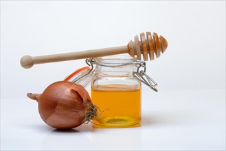 Honey in a jar and onion, ingredients for cough syrup