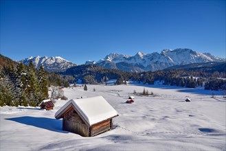 View of the frozen and snow-covered Geroldsee lake in Werdenfelser Land near Garmisch, with the
